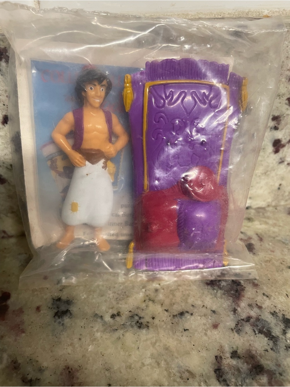 vintage Burger King Kid's Club toy features plastic Aladdin figure Magic Carpet